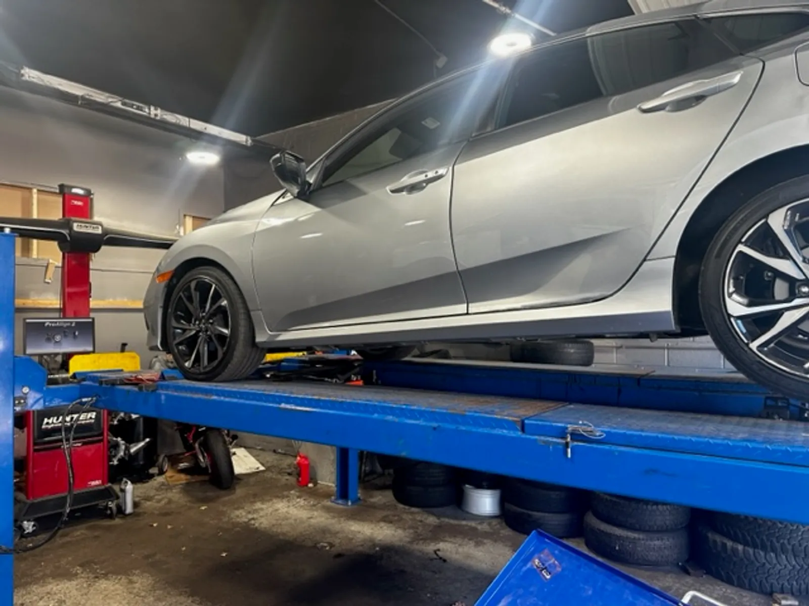 A vehicle on the alignment rack at JW Auto Repair in Framingham, MA
